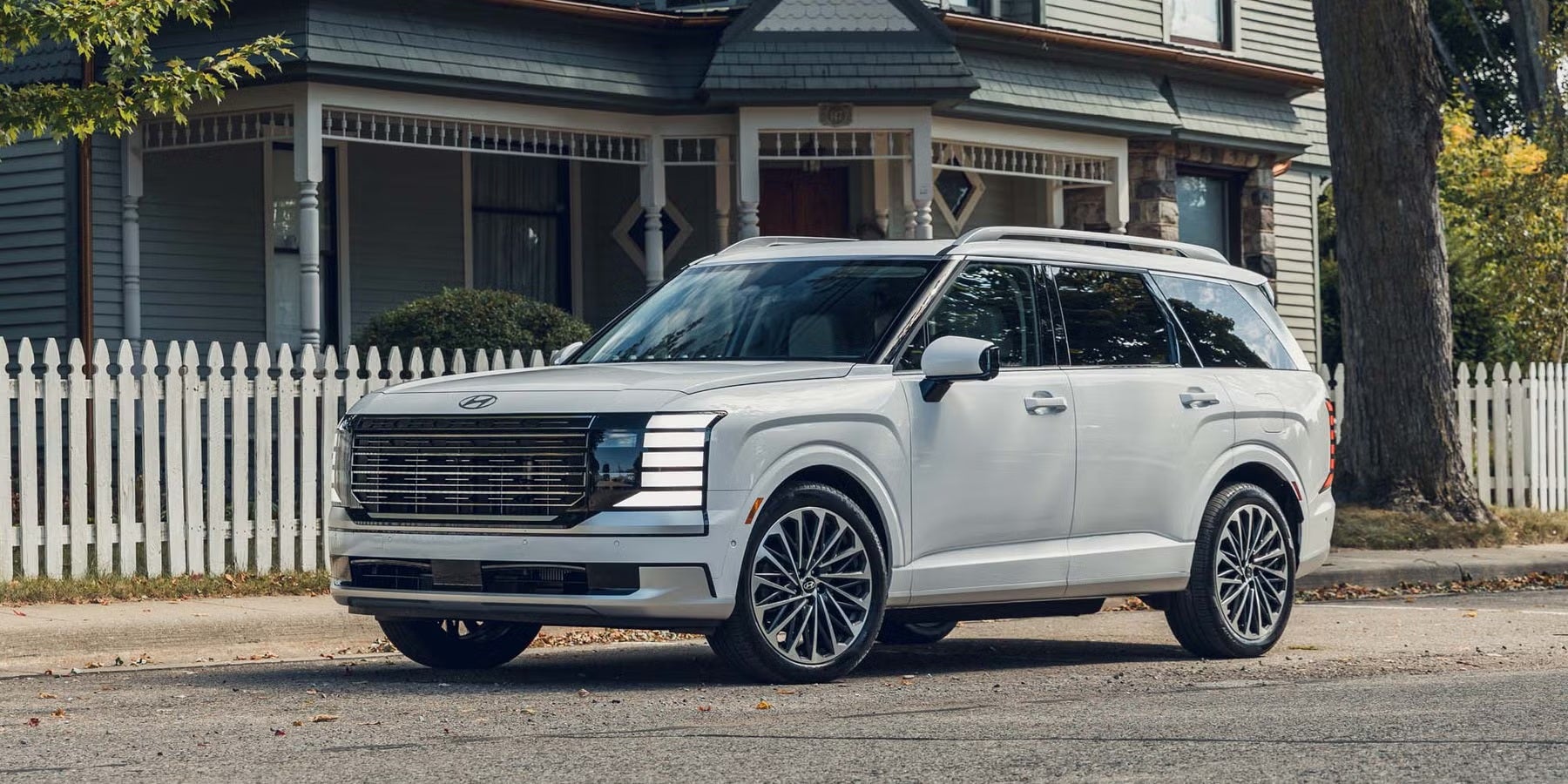 white hyundai palisade hybrid parked infront of house in danville va